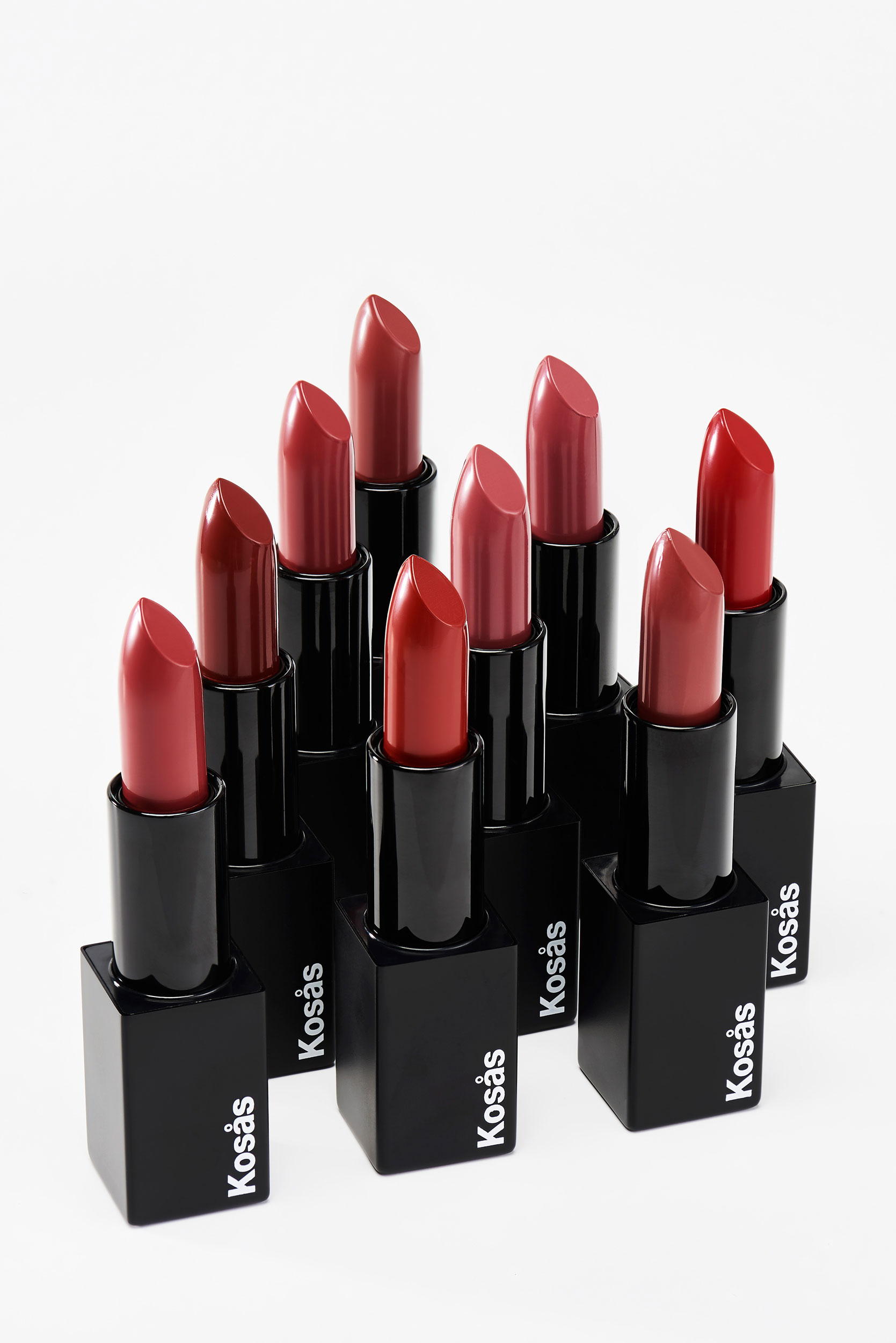 Lipstick tubes styled neatly displaying interior shades of red