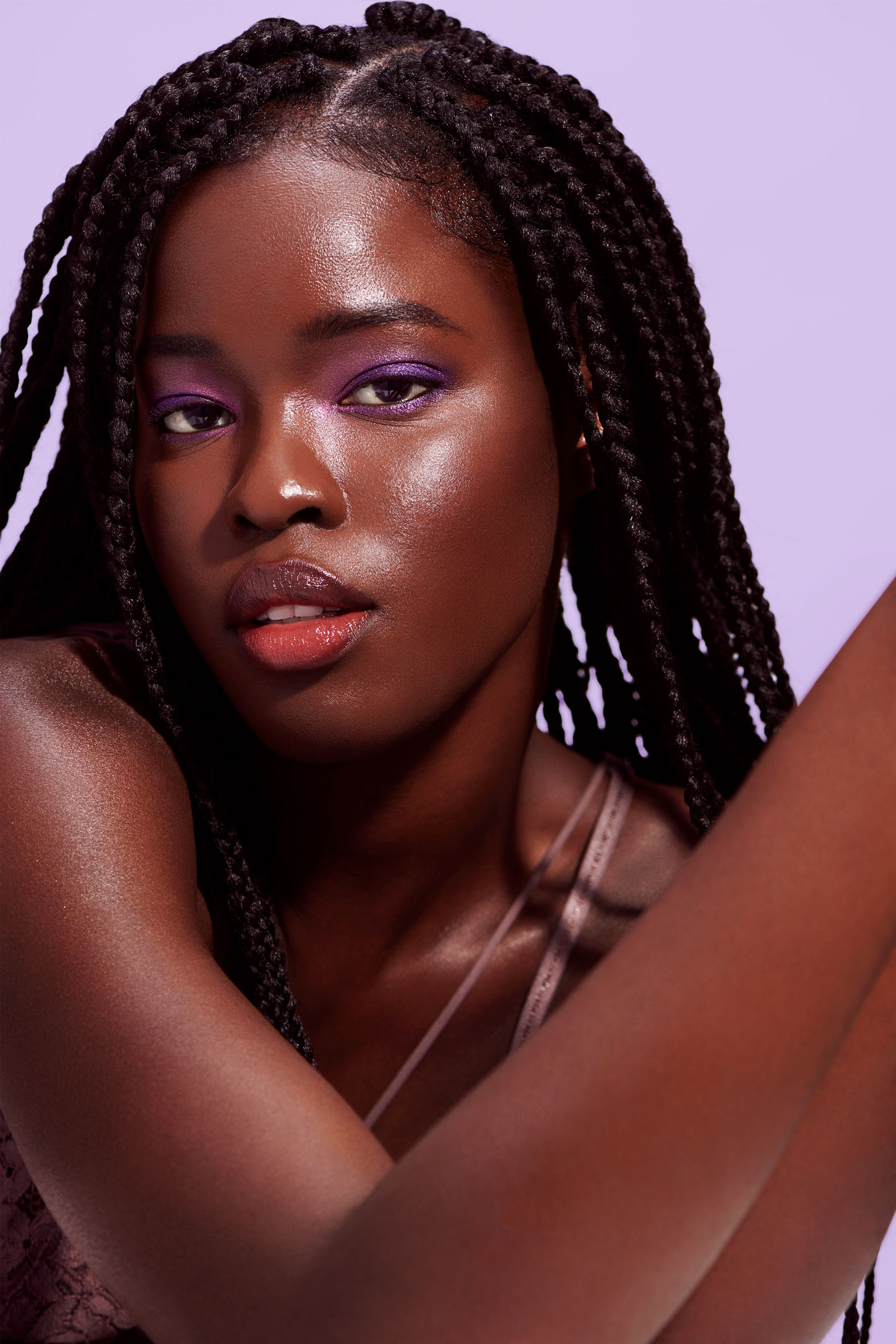 Portrait of Black female model with purple eyeshadow