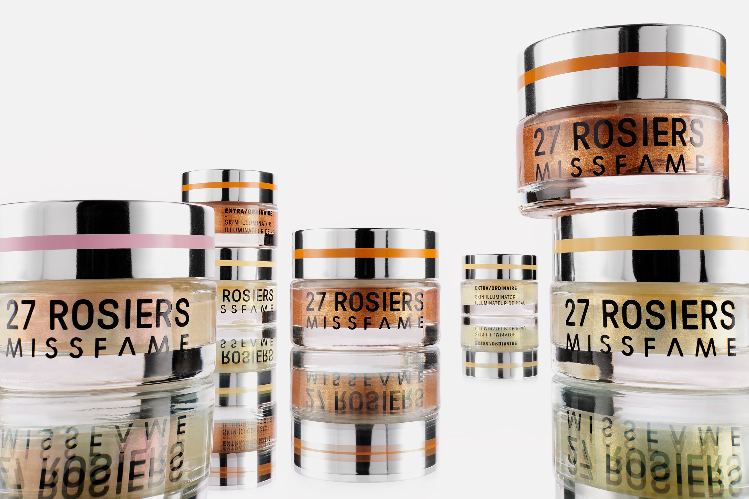 Cosmetics containers on mirrored surface