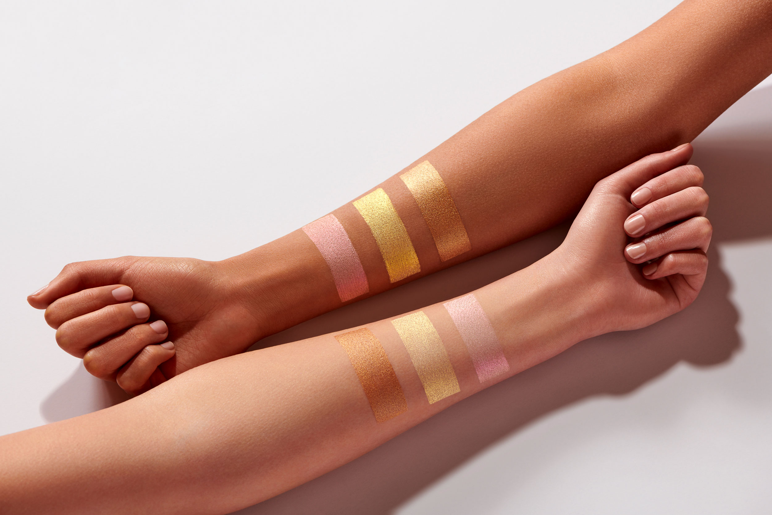 Makeup swatches on two diverse skin tones