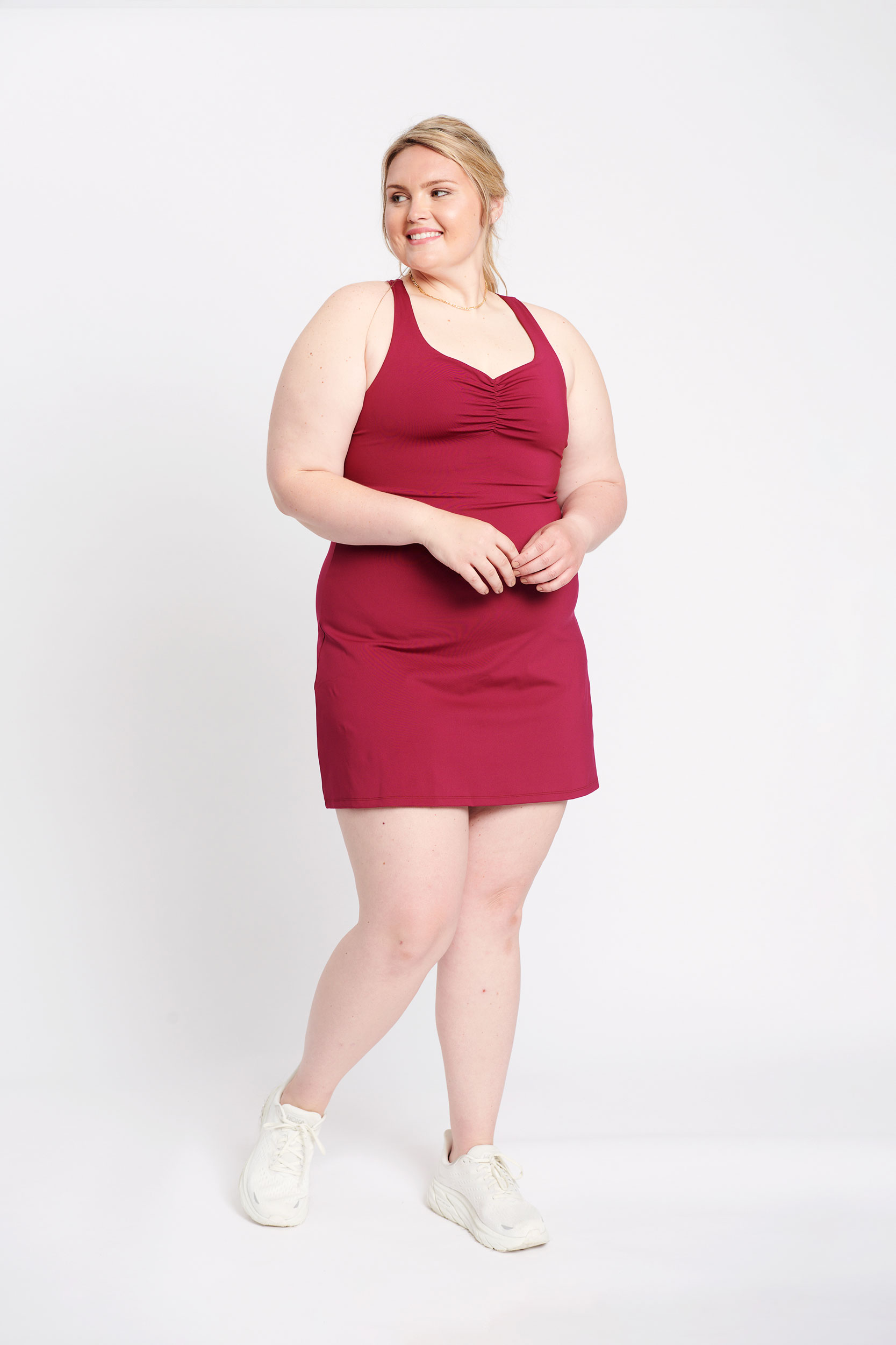 Plus-sized woman wearing red athleisure dress