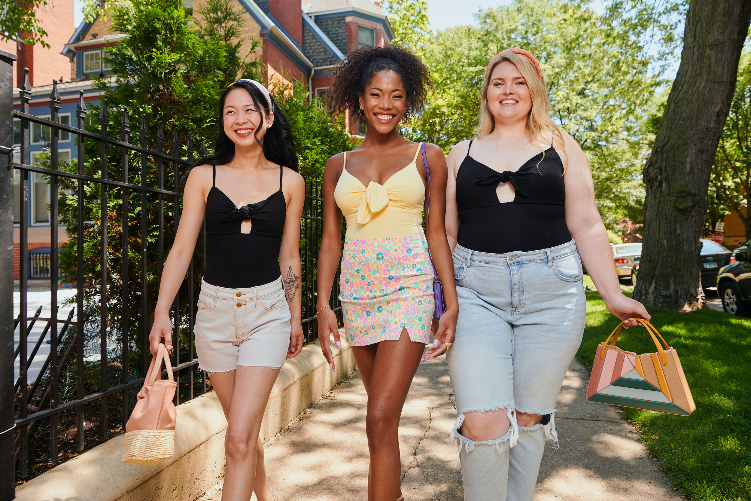 Three women walking, styled in summer clothing