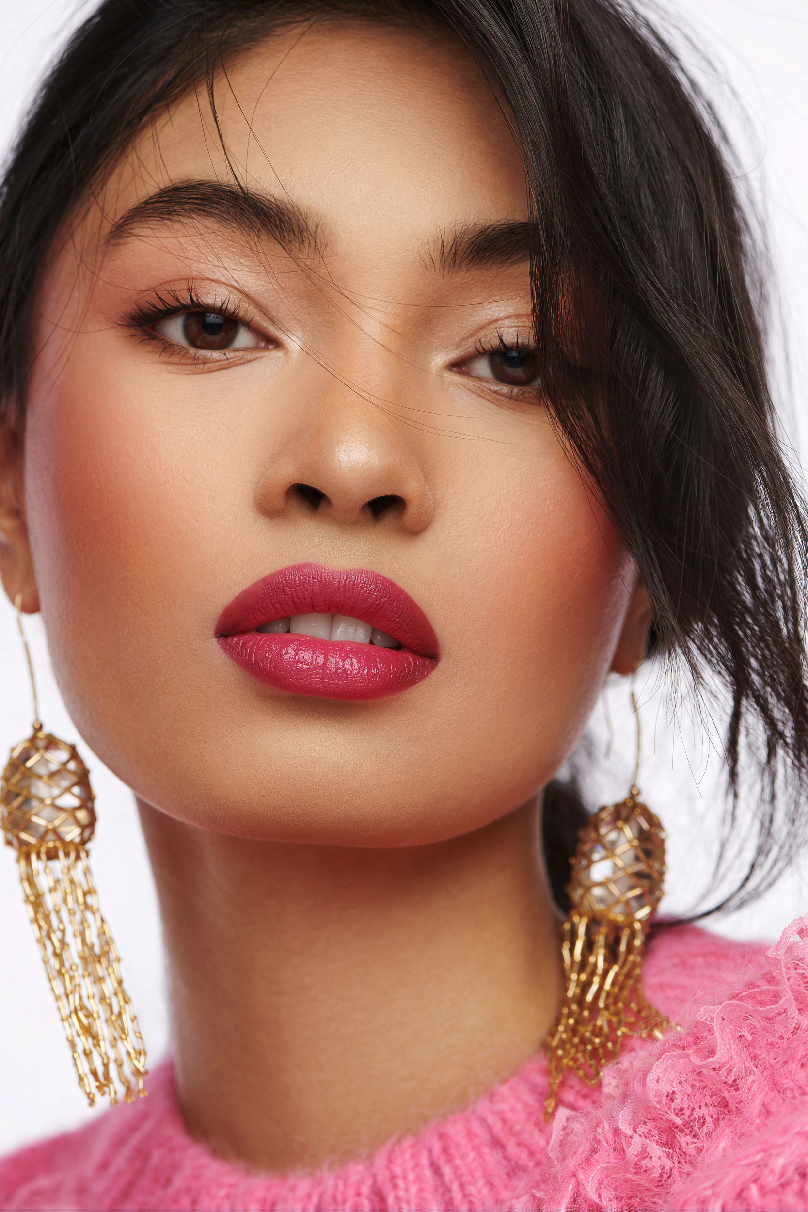 Woman wearing Viva Magenta lipstick