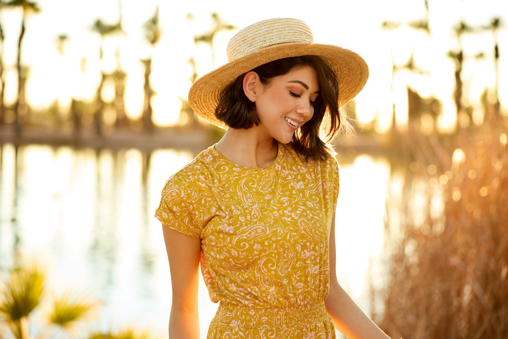 Brunette female in yellow sundress and hat